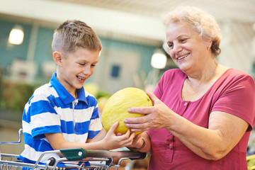 Family with child shopping fruits
