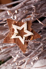christmas star decoration with wooden branches
