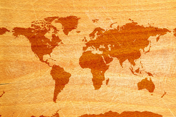 World map on wood background