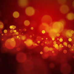 Orange bokeh lights on dark red background
