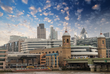 Fototapeta na wymiar City of London with clouds, financial center and Canary Wharf at