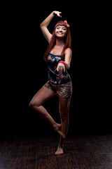 smiling female dancer showing move