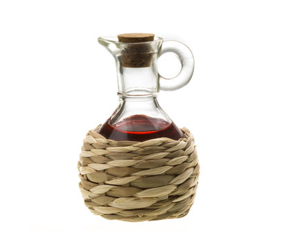 Small Decanter With Red Wine Vinegar Isolated On The White