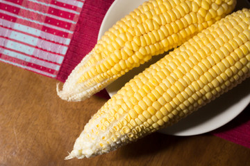 Raw corn on dish