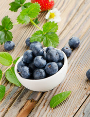 Blueberries on wooden table.
