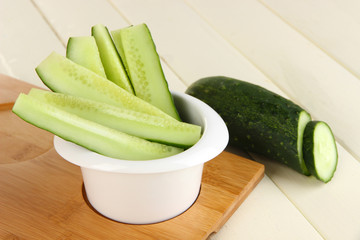 Bright fresh cucumber cut up slices in bowl