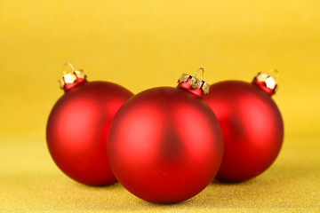 Christmas balls on yellow background