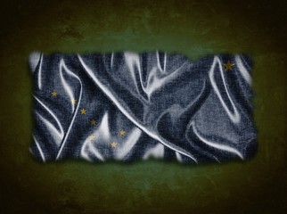 Illustration with a vintage Alaska flag on green background.