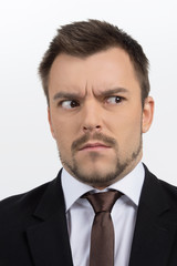 Frustrated businessman. Portrait of shocked businessman looking