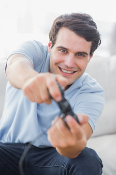 Portrait of a cheerful man playing video games