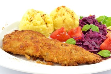 pollock fried with potatoes and vegetables