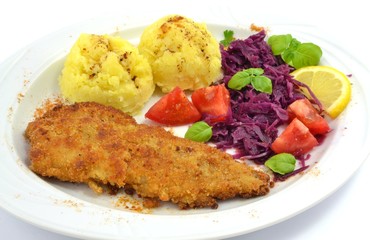 pollock fried with potatoes and vegetables