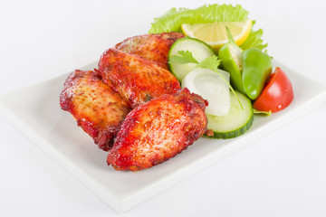 Hot Wings - Spicy and hot chicken wings served with salad.