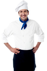 Smiling confident young male chef