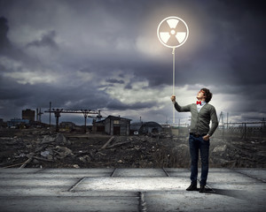 Young man with a recycle symbol