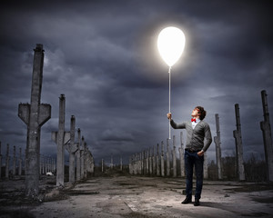 Young man holding a light