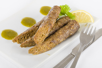 Seekh Kebabs - Minced meat kebabs with mint and coriander sauce.