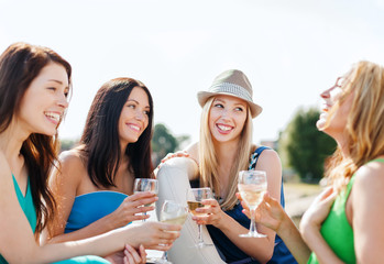 girls with champagne glasses on boat