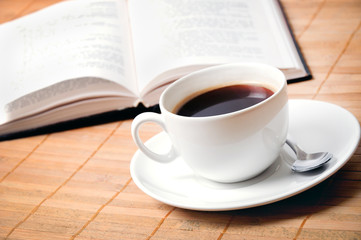 Cup of coffee  with book