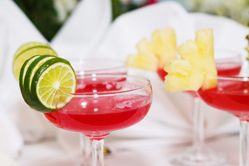 exotic cocktails and flowers on table