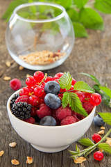 assorted berries on wooden background .