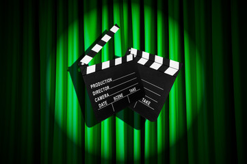 Movie clapper board against curtain