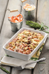 Pasta with seafood on rustic wooden table. Summer party food