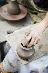 potter man hands shaping ceramic craft