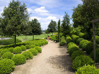 Girl walking through the Amboise garden