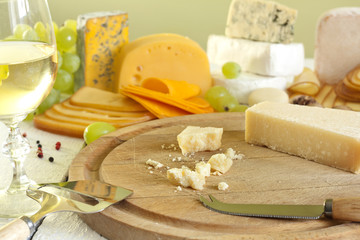 Grana padano cheese on cutting board