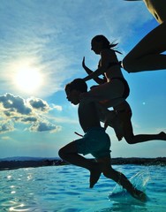 kids jumping in pool