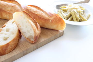 sliced baguette on wooden board,