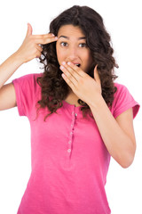 Fototapeta premium Brown haired woman making gun gesture