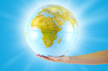 Naklejka premium Earth globus in hand, various background