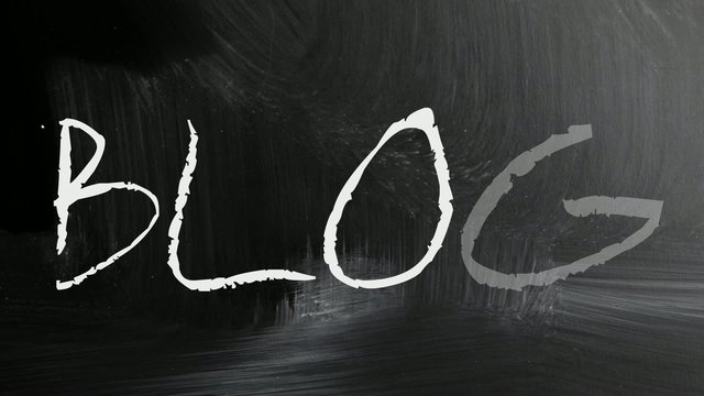 "Blog" handwritten with white chalk on a blackboard