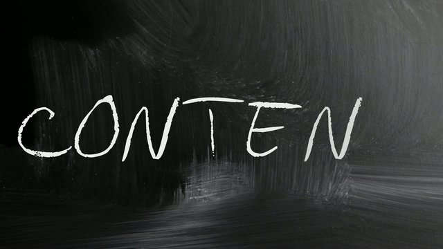 The word "Content" handwritten with white chalk on a blackboard