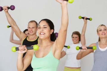 Group Of People Exercising In Dance Studio With Weights © micromonkey