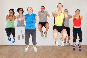 Fototapeta premium Group Of People Exercising In Dance Studio