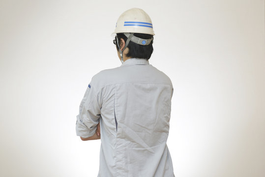 腕組みをする男性作業員の後姿 Stock Photo Adobe Stock 腕組みをする男性作業員の後姿 Stock Photo Adobe Stock