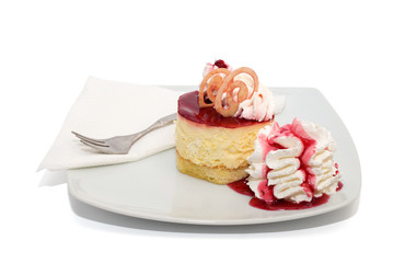 Vanilla cake with cream and cherry isolated