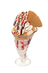 Icecream cup with cream, topping and cookies isolated