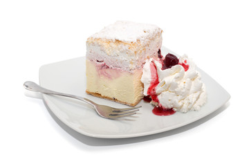 Vanilla cake with cream and cherry isolated