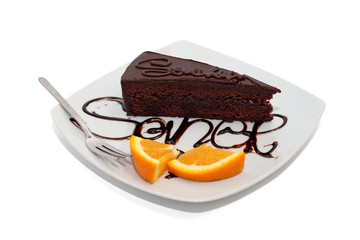 Chocolate cake with orange and topping isolated