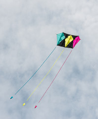 Colorful kite against a cloudy sky