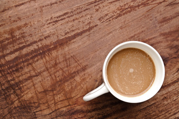 cup of coffee on wood table