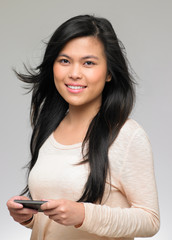 Naklejka premium Studio Shot Of Teenage Girl Sending Text Message