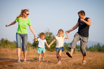 Fototapeta premium happy family walking on the road