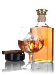 Brandy with ice and cigar isolated on white