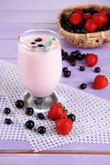 Delicious milk shake with blackberry and strawberries