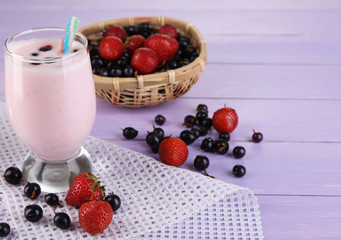 Delicious milk shake with blackberry and strawberries